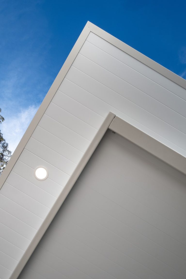 Close-up of a Luxe Cantilever pergola corner with downlight