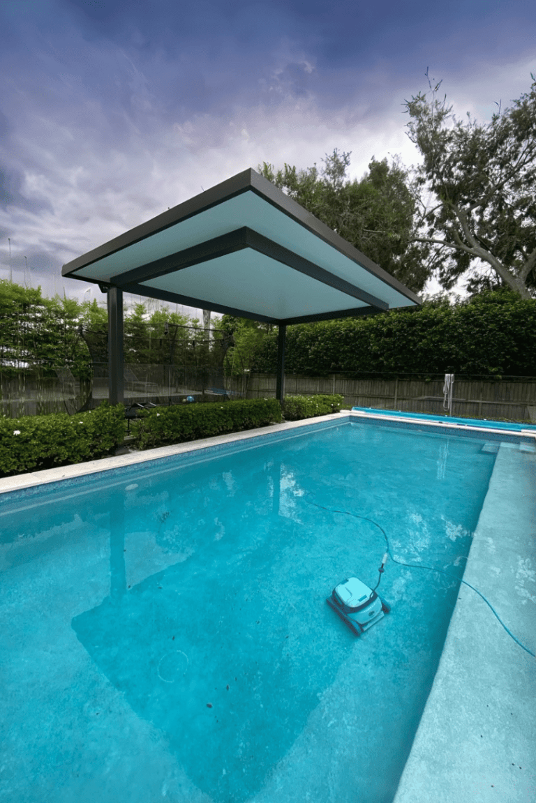 Cantilever pergola beside an inground pool